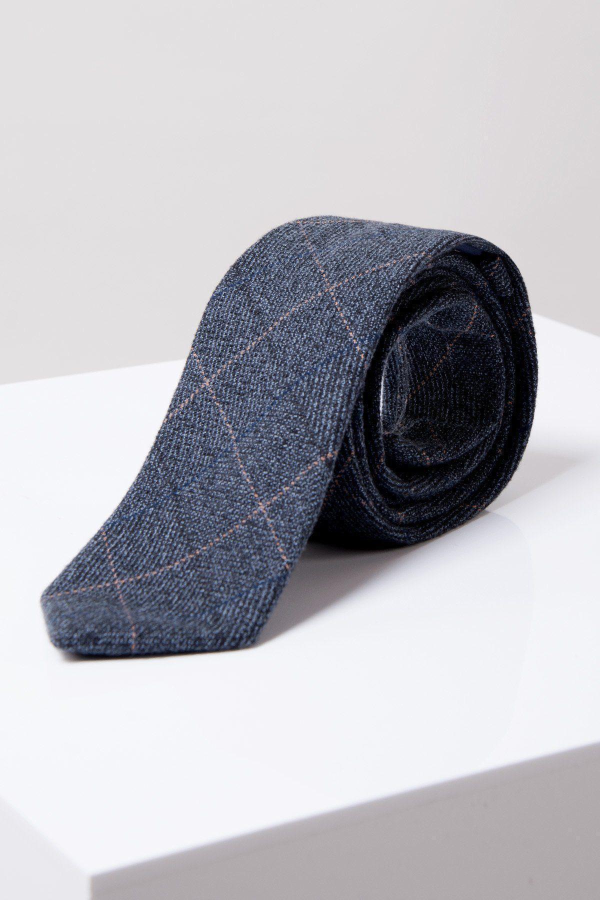 The Accessory SCOTT - Blue Tweed Check Tie features a subtle plaid pattern with thin light lines, rolled up and displayed on white against a light gray background—a refined formalwear choice.