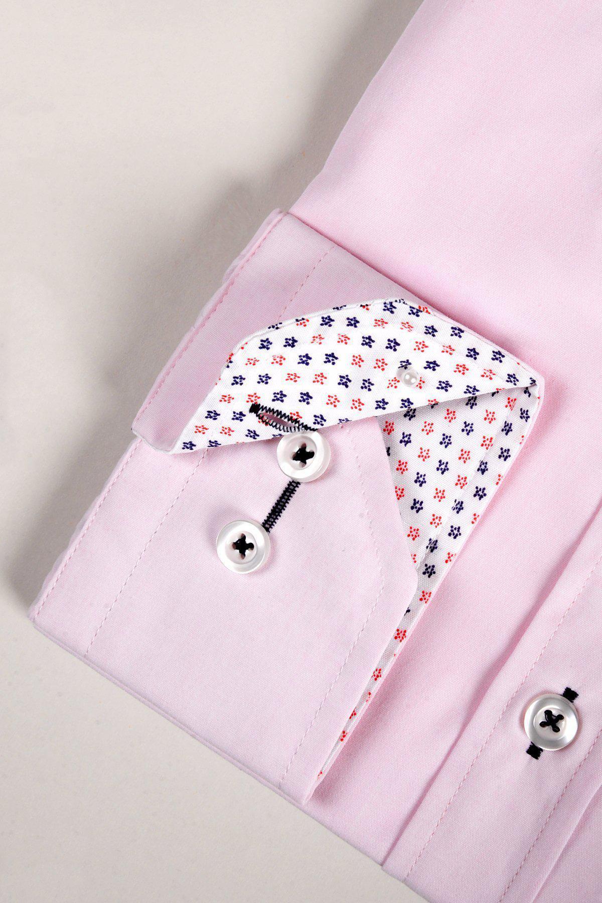 Close-up of the marcdarcy SERGIO pink long sleeve shirts tailored cuff with white buttons and a white lining accented by small navy blue and red geometric patterns.