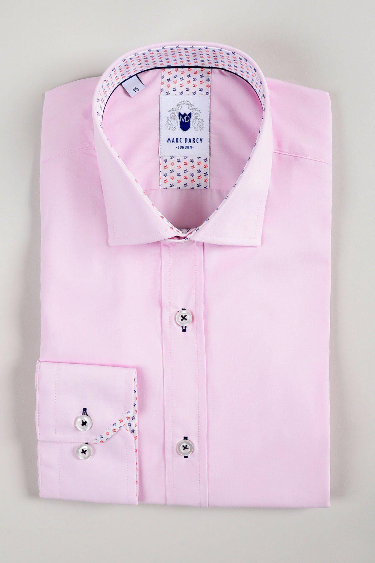 The SERGIO Pink Long Sleeve Shirt by marcdarcy features white buttons and colorful patterned accents on the inner collar and cuffs, neatly folded and displayed on a plain light surface.