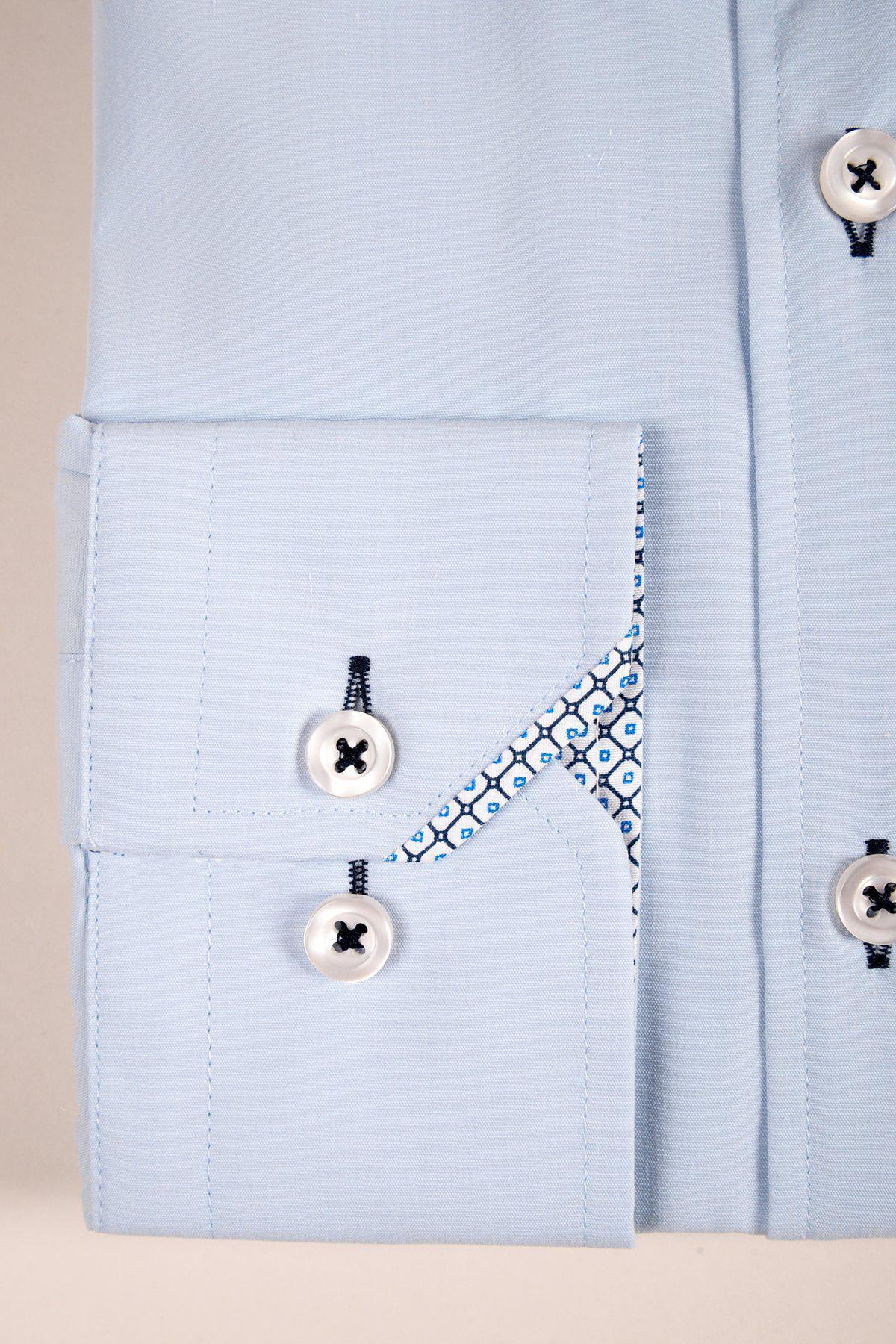 Close-up of the marcdarcy SERGIO Sky Blue Long Sleeve Shirt cuff with white buttons, navy stitching, and an inner cuff lined with blue and white geometric fabric—ideal for polished office wear.