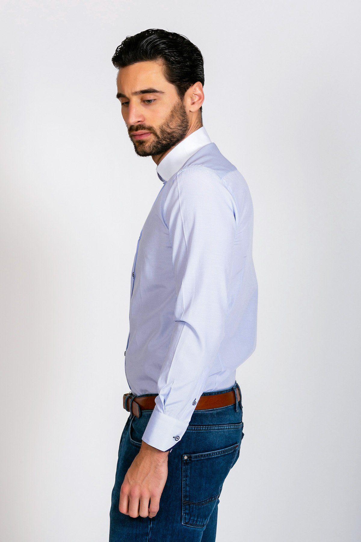 A man with dark hair and a beard stands sideways against a plain white background, wearing the Marc Darcy SHELBY Sky Blue Stripe Penny Collar Shirt tucked into blue jeans with a brown belt.
