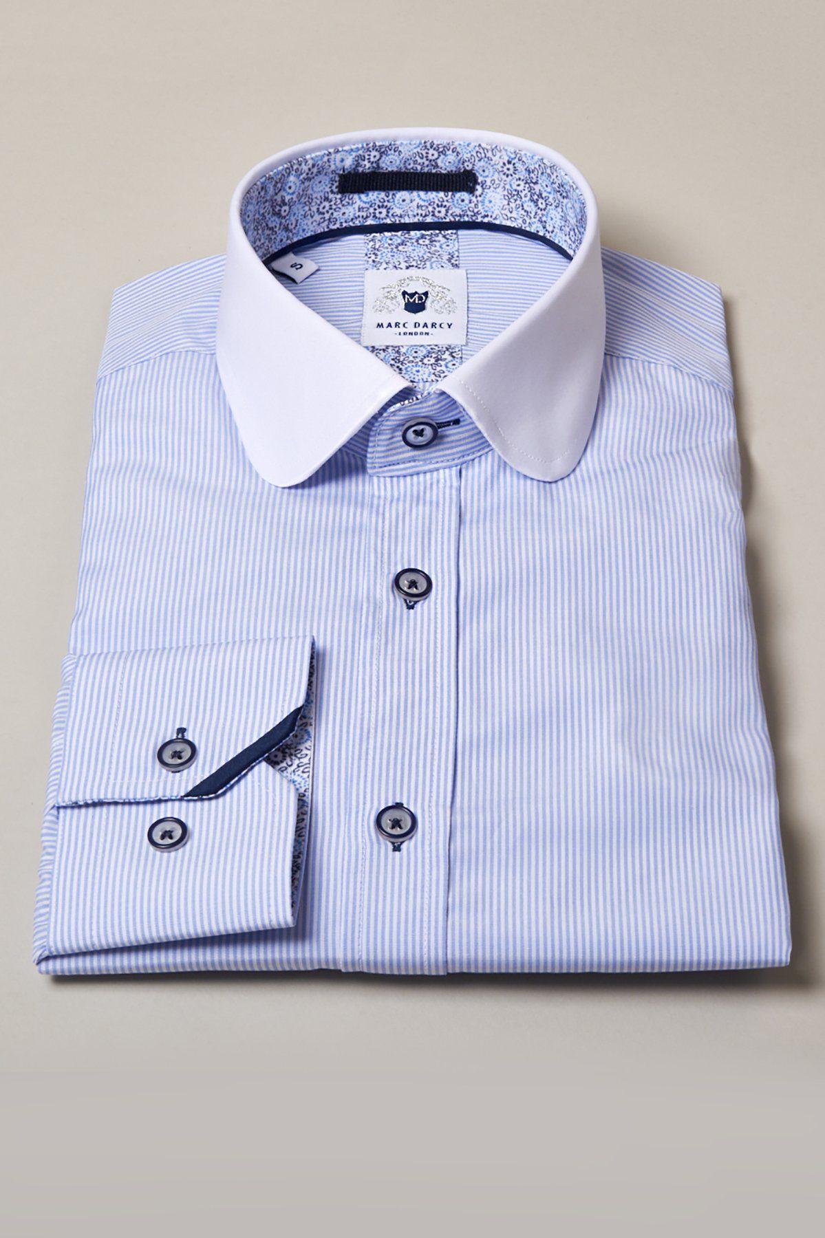 The Marc Darcy SHELBY Sky Blue Stripe Penny Collar Shirt features a white Peter Pan collar, dark blue buttons, and classic fit with subtle blue floral patterns on the collar lining and inner cuff for added charm.