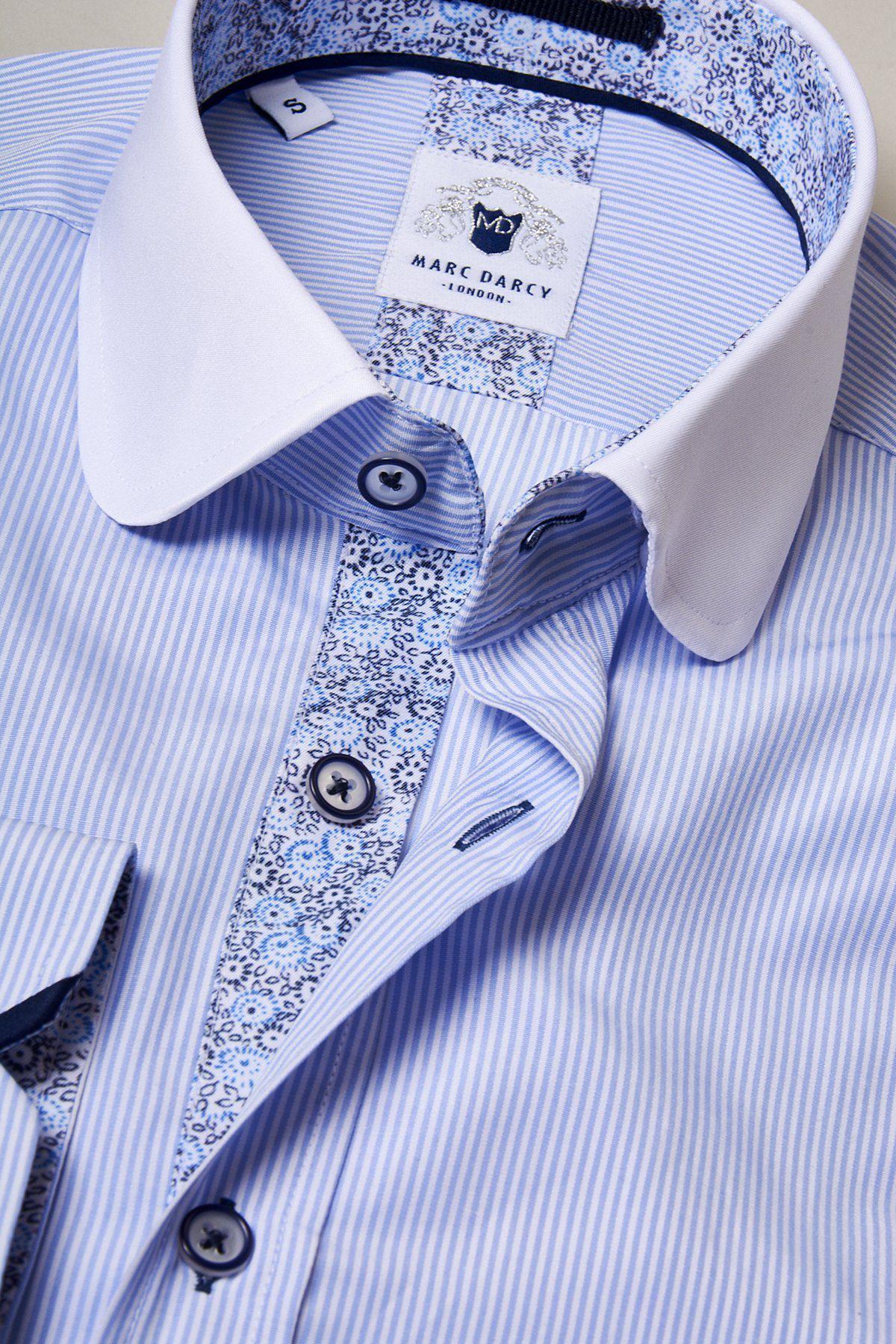 Close-up of the SHELBY Sky Blue Stripe Penny Collar Shirt by Marc Darcy, featuring a white collar and patterned trim.