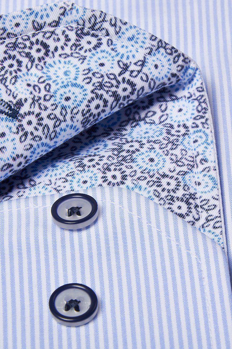 Close-up of the Marc Darcy SHELBY Sky Blue Stripe Penny Collar Shirt cuff, featuring white and blue vertical stripes, two dark buttons, and a contrasting inner fabric with a blue and black floral pattern.