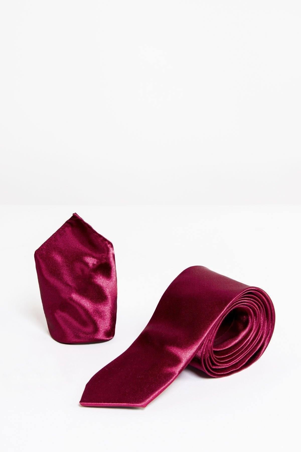 The Accessory STANLEY - Satin Tie and Pocket Square Set in Wine features a deep burgundy satin tie and matching pocket square, elegantly displayed together on a white surface with a plain white background.