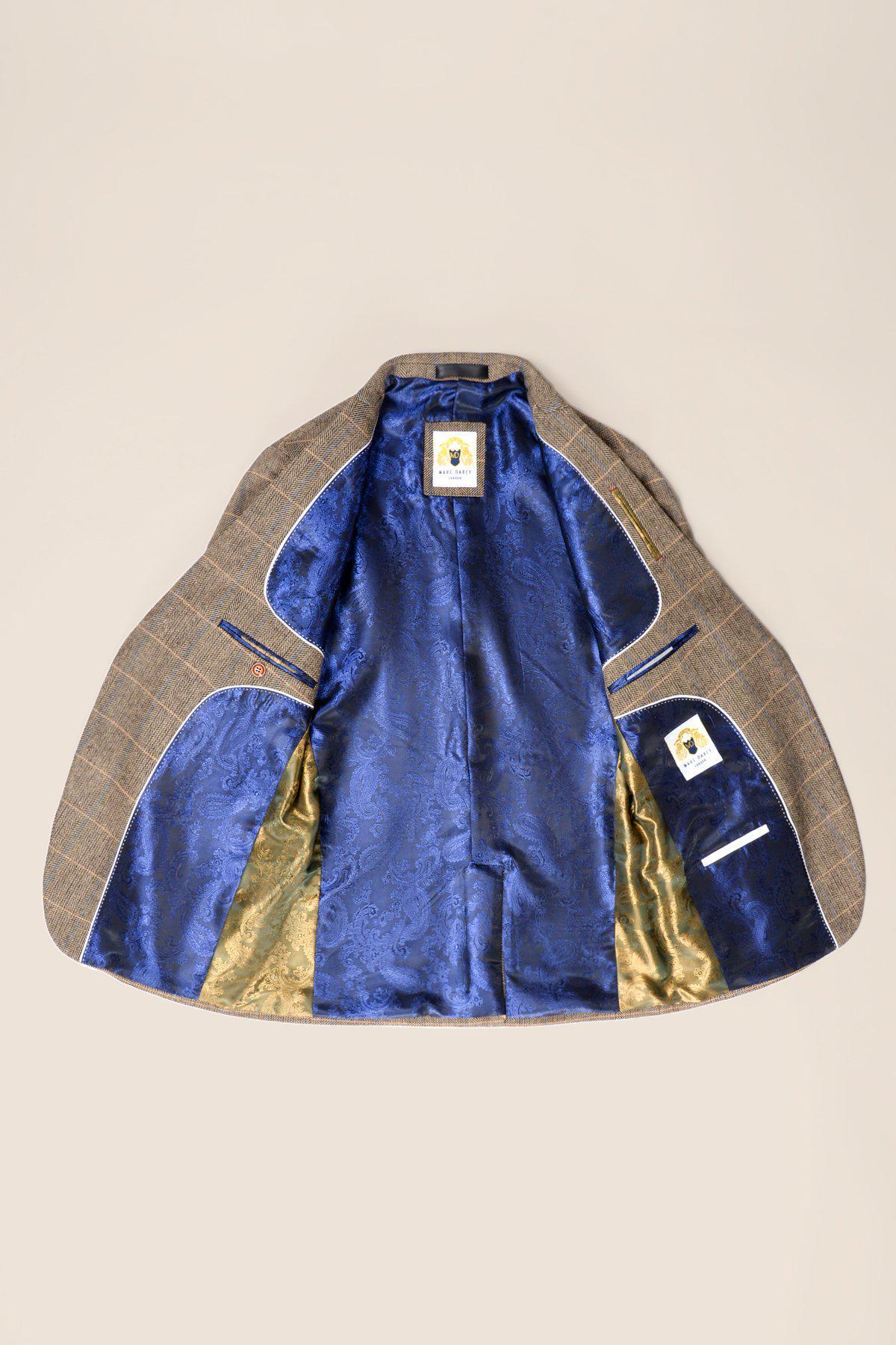 The marcdarcy TED - Tan Tweed Check Suit with Kelvin Cream Waistcoat is shown open, highlighting its blue patterned lining with gold accents, interior pockets, and sewn-in labels.