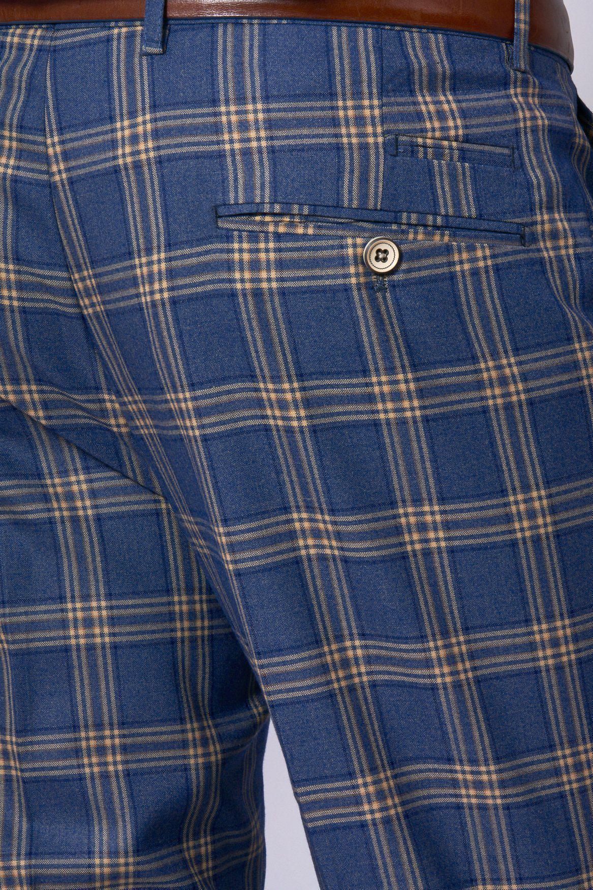 Close-up of the back of a person wearing marcdarcys TONY Blue Yellow Check Suit with a single breasted waistcoat, featuring buttoned back pockets, waistband loops, a brown belt, and showcasing the slim fit tailoring.