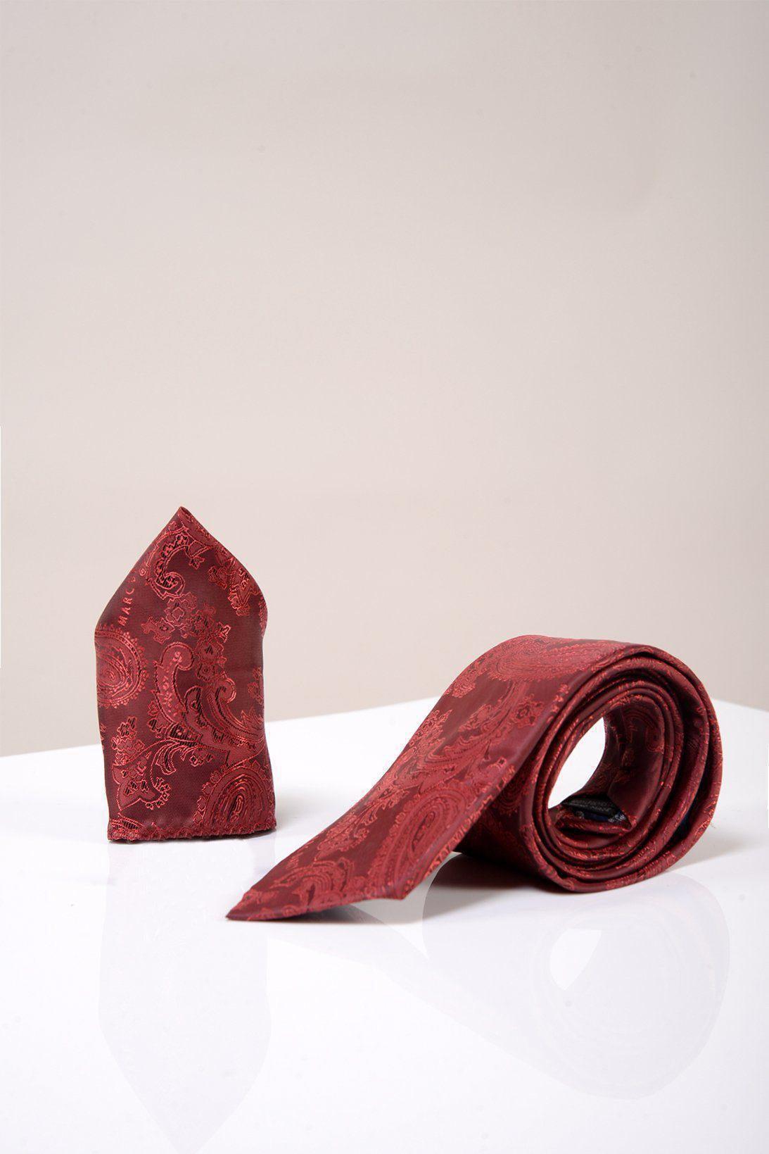 The Accessory MD PAISLEY Wine Paisley Tie and Pocket Square Set is displayed rolled up beside its matching square on a glossy white surface against a plain light background.