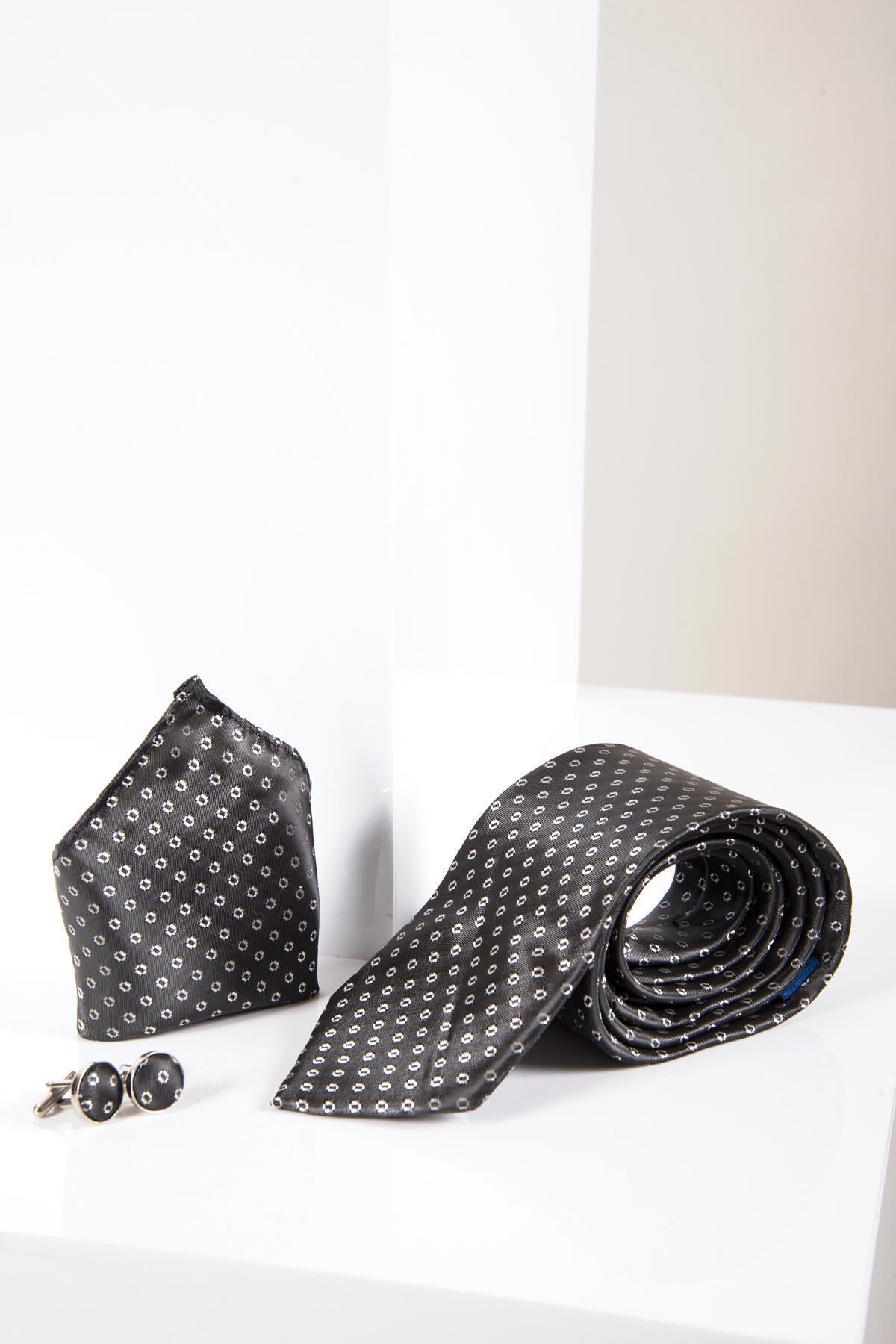 The Marc Darcy TS TUBES - Grey Spot Tie and Pocket Square Set features a sleek silk-style texture with small white dots, elegantly displayed on a glossy white surface for a sophisticated formal look.
