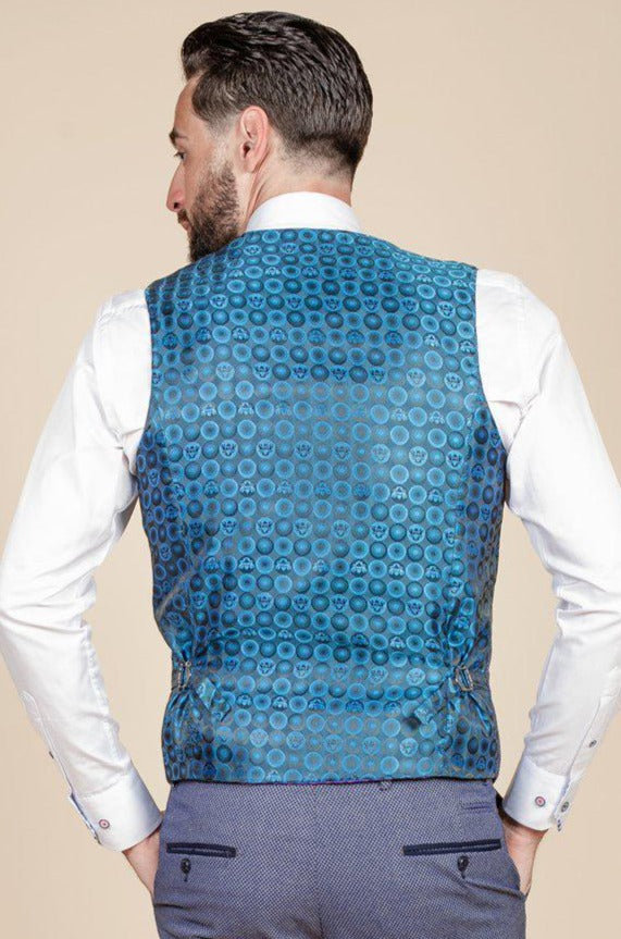 A man seen from behind wears a slim fit white dress shirt, marcdarcy WILSON - Blue Birdseye Waistcoat, and light blue trousers, standing against a beige background.